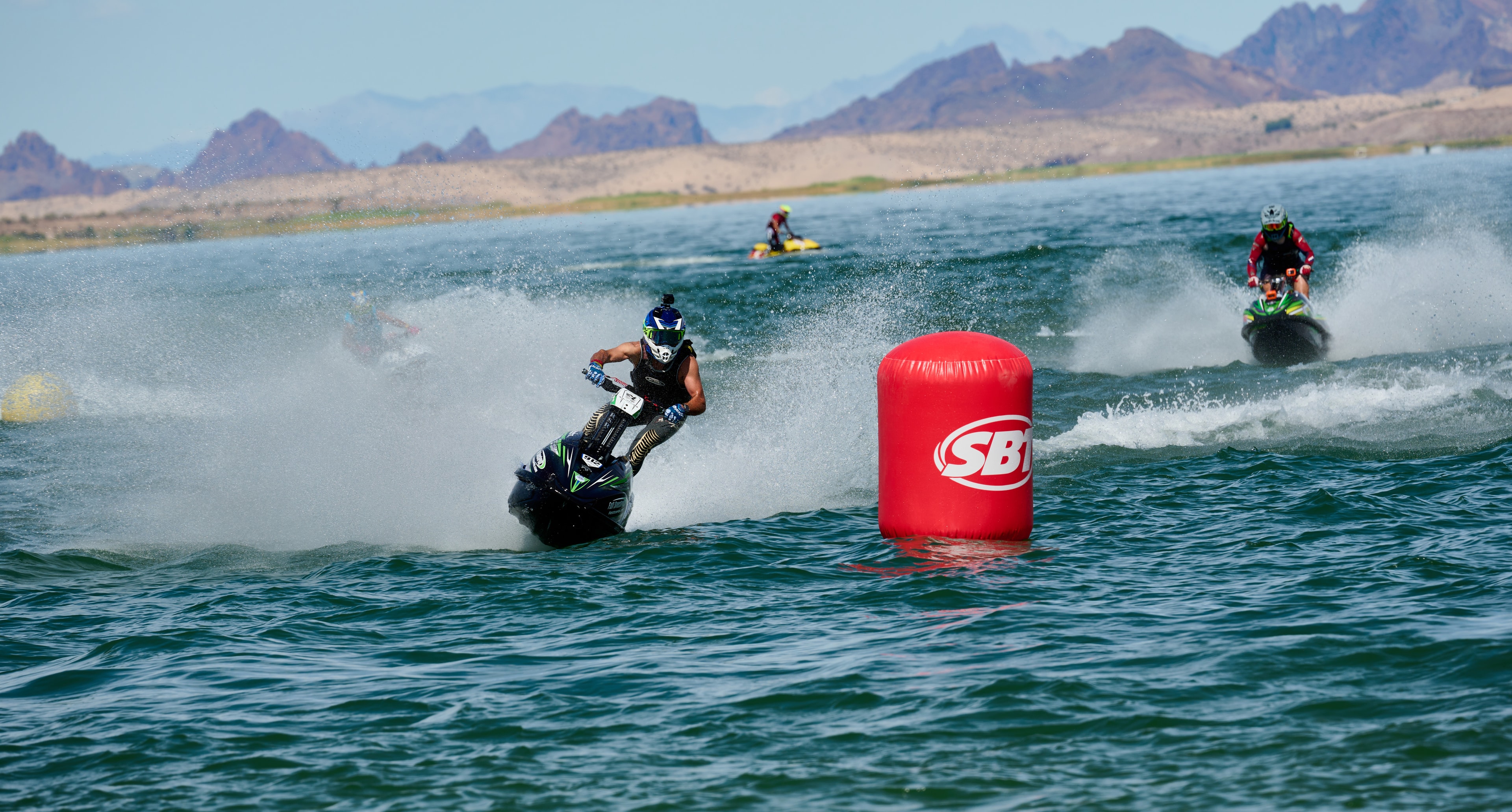SBT World Finals — jetski racer rounding a buoy with mountain backdrop